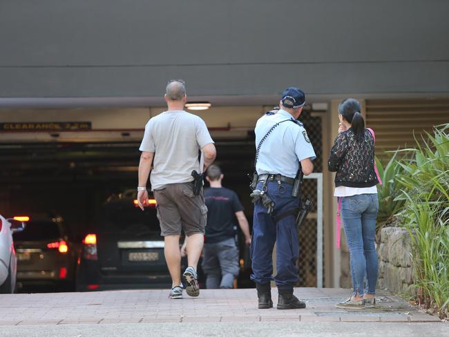 Police speak with residents. Picture: Richard Dobson