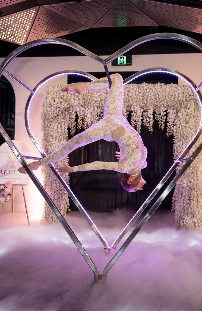 Bec Harvey and Andrew Deasy's wedding at Customs House featured an epic acrobatic performance during the reception. Pictures: Evernew Studio