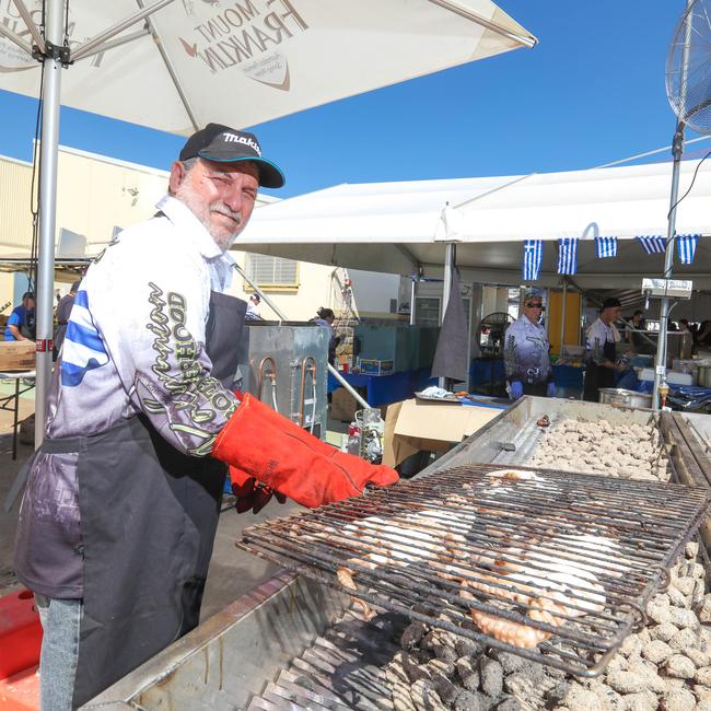 Kostas Nicolakis prepares the barbecued octopus at the Festival of Agios Panteleimon. Picture: Glenn Campbell