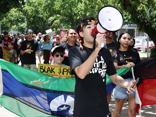 Event organiser Manny Williams leads the Invasion Day rally protest march along the Esplanade on Australia Day. Picture: Brendan Radke