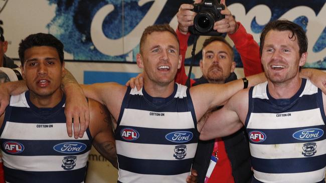 Tim Kelly, Joel Selwood, Patrick Dangerfield, Mitch Duncan, Gary Rohan of the Cats sing the team song after the Round 5 AFL match between the Hawthorn Hawks and the Geelong Cats at the MCG in Melbourne, Monday, April 22, 2019. (AAP Image/Daniel Pockett) NO ARCHIVING, EDITORIAL USE ONLY