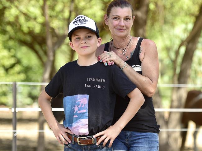 Selfless kid Clancy Pratchett, 9, donates his hard earned pocket money to Michelle Bible from Michelle's Ark Animal Rescue. PICTURE: MATT TAYLOR.