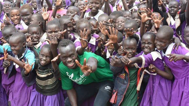 Awer Mabil has been doing plenty of good work through his foundation Barefoot to Boots. Picture: Facebook