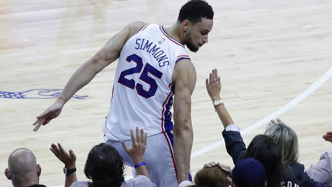 PHILADELPHIA, PENNSYLVANIA - JUNE 20: Ben Simmons #25 of the Philadelphia 76ers bumps into fans during the fourth quarter during Game Seven of the Eastern Conference Semifinals against the Atlanta Hawks at Wells Fargo Center on June 20, 2021 in Philadelphia, Pennsylvania. NOTE TO USER: User expressly acknowledges and agrees that, by downloading and or using this photograph, User is consenting to the terms and conditions of the Getty Images License Agreement.   Tim Nwachukwu/Getty Images/AFP == FOR NEWSPAPERS, INTERNET, TELCOS & TELEVISION USE ONLY ==