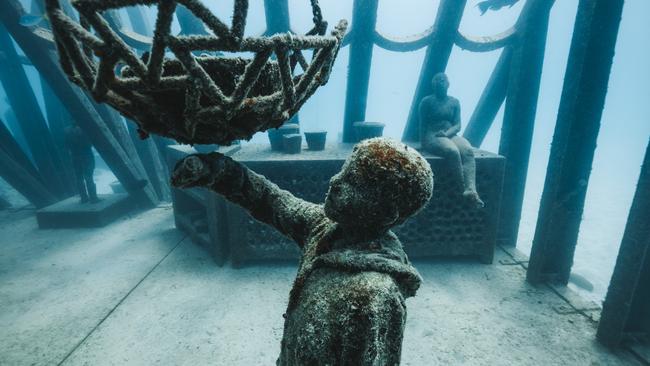 Underwater art installations by Jason deCaires Taylor near Townsville. Picture: TEQ