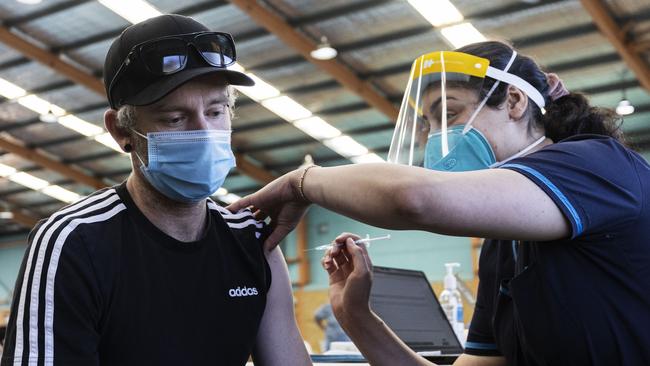 A nurse administers a dose of the AstraZeneca vaccine at a pop-up walk-in clinic in Sydney. Picture: Getty Images