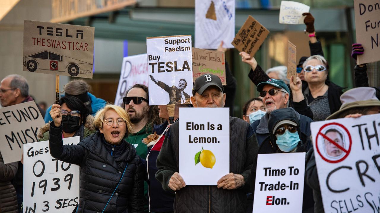 <!DOCTYPE html PUBLIC "-//W3C//DTD HTML 4.0 Transitional//EN" "http://www.w3.org/TR/REC-html40/loose.dtd"><html><body><p>Protesters hold signs including &acirc;&#128;&#152;Elon is a lemon&acirc;&#128;&#153; and &acirc;&#128;&#152;Time to trade-in Elon&acirc;&#128;&#153; in Boston. Picture: Joseph Prezioso / AFP</p></body></html>