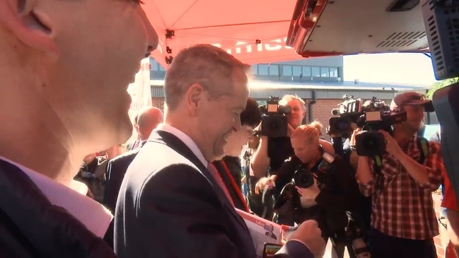 On your bike: Shorten responds to anti-Adani protesters at polling booth