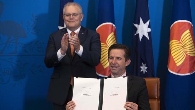 Prime Minister Scott Morrison and Trade Minister Senator Simon Birmingham signing the Regional Comprehensive Economic Partnership trade deal. Picture: Gary Ramage