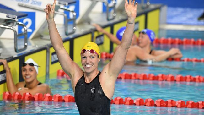 Emily Seebohm celebrates her 50m backstroke gold last night. Her 15 medals equal Susie O’Neill’s Australian record. Picture: AAP