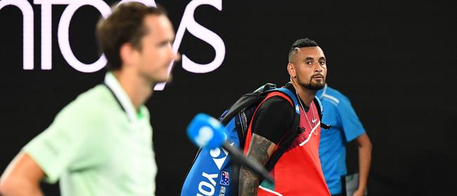 Kyrgios looks on as Medvedev takes questions at the end of the match.