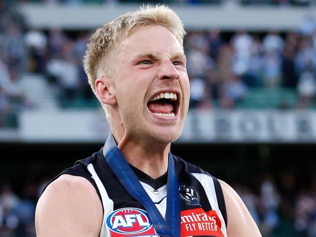 MELBOURNE, AUSTRALIA – SEPTEMBER 30: Billy Frampton of the Magpies celebrates after receiving his premiership medal during the 2023 AFL Grand Final match between the Collingwood Magpies and the Brisbane Lions at the Melbourne Cricket Ground on September 30, 2023 in Melbourne, Australia. (Photo by Dylan Burns/AFL Photos via Getty Images)