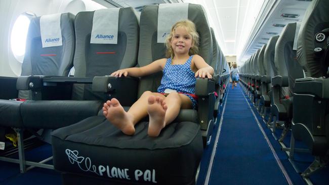 STRETCHING OUT: A child using the Plane Pal inflatable pillow.