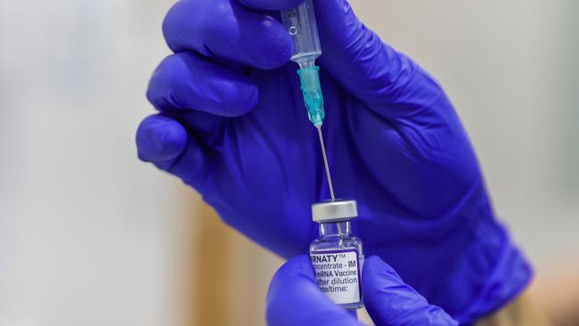 SYDNEY, AUSTRALIA - JANUARY 10: A COVID-19 vaccine is prepared at Sydney Road Family Medical Practice in Balgowlah on January 10, 2022 in Sydney, Australia. NSW has recorded 18 deaths in the last 24 hours from COVID-19, including a child under five. (Photo by Jenny Evans/Getty Images)