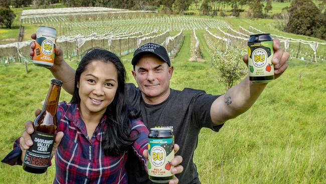 Fresh look: Jenny and Marc with the cider varieties they sell Three of them are now available in cans. Picture: Zoe Phillips