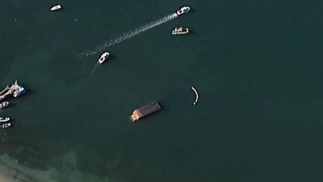 A barge overturned at Great Mackerel Beach. Picture: 7 News