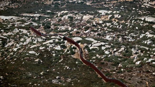 The US-Mexico border fence at the Cuchuma hill, in Tecate, Baja California State, Mexico. Picture: AFP