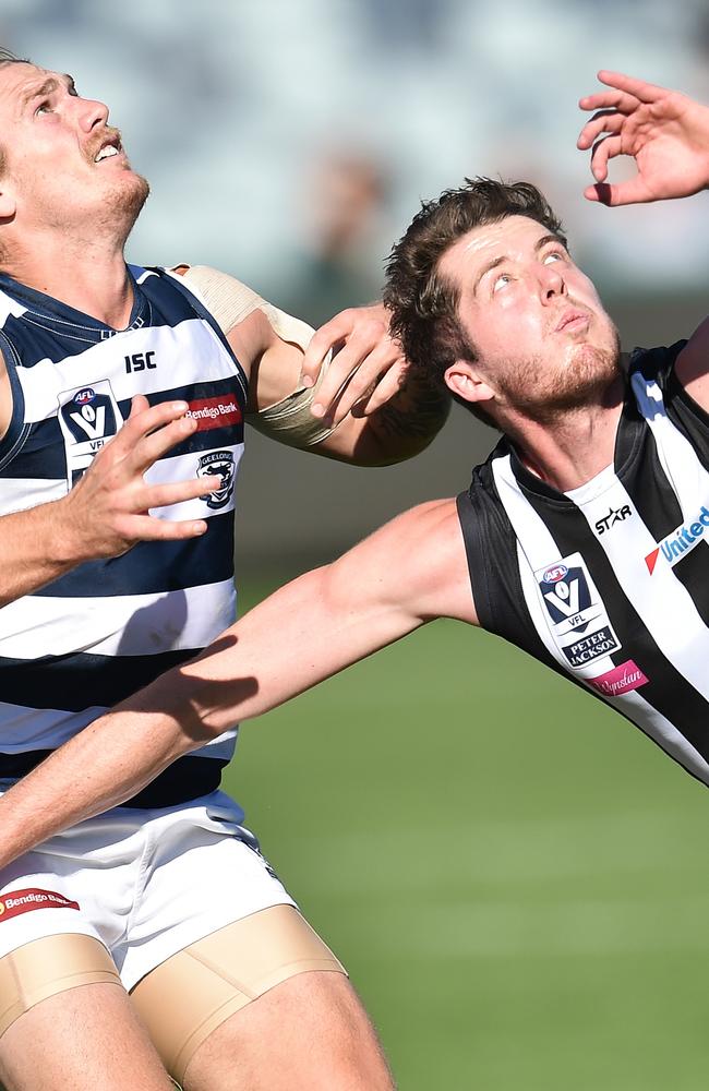 Darrean Wyatt playing at Collingwood and battling it out with Geelong’s Tom Stewart.