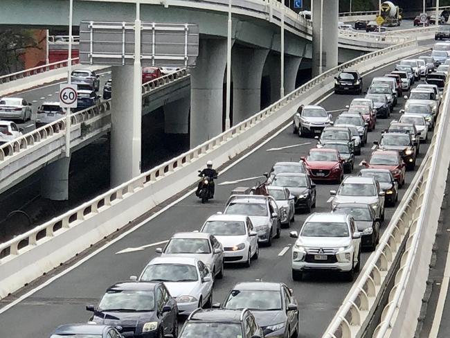 Traffic backed up on the Riverside Expressway after a protester erected a tripod and blocked the Hale Street on-ramp. Picture: Tara Croser