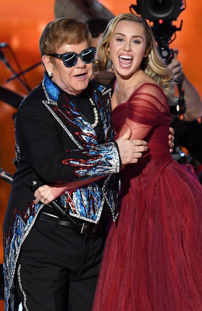 Recording artists Sir Elton John and Miley Cyrus perform onstage. Picture: Getty