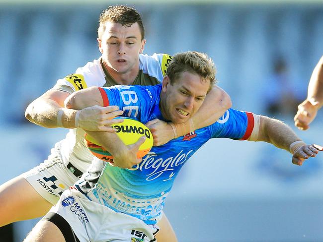 Mitchell Aubusson of the Roosters is tackled by Dylan Edwards of the Panthers in the Nines final at Eden Park, New Zealand. Picture: Mark Evans