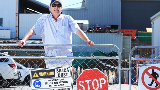 Derick Brosnan, managing director at La Rocca Marble and Granite on the Gold Coast, has spent hundreds of thousands ensuring this workers are safe from silica dust. Photo: Scott Powick News Corp