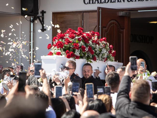 Kettule’s coffin is carried from the church on Saturday.