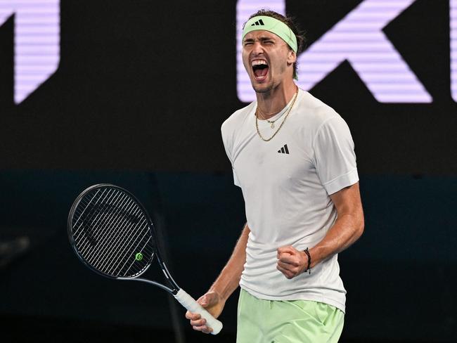 Germany's Alexander Zverev celebrates after victory against Spain's Carlos Alcaraz during their men's singles quarter-final match on day 11 of the Australian Open tennis tournament in Melbourne on January 25, 2024. (Photo by Paul Crock / AFP) / -- IMAGE RESTRICTED TO EDITORIAL USE - STRICTLY NO COMMERCIAL USE --