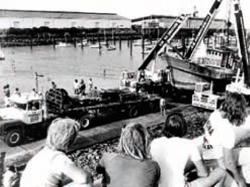 Historic Mackay, 1977: The illegal Taiwanese fishing junk the Shin Hsun Yuan No 3 is removed from Mackay Harbour and then transported to the City Gates. It remained there until 1990, when it was sold and the timber recycled. Some of it was used to make tables and one is in use in the boardroom of the Mackay Tourism. Photo Daily Mercury Archives