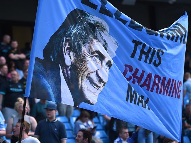 Manchester City fans hold a banner thanking Manuel Pellegrini after his last game.