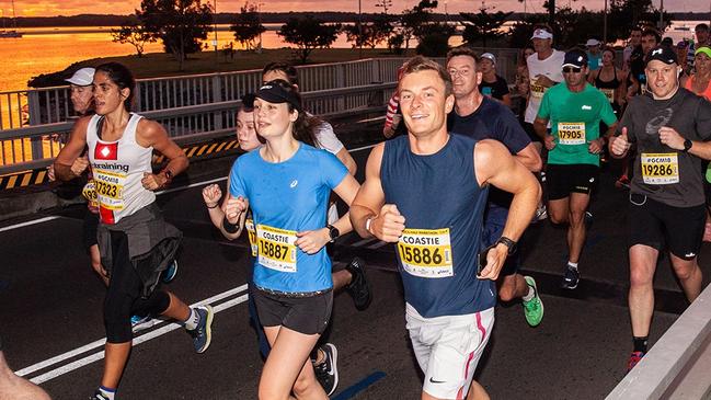 Off and running in the early morning light for the Gold Coast Marathon