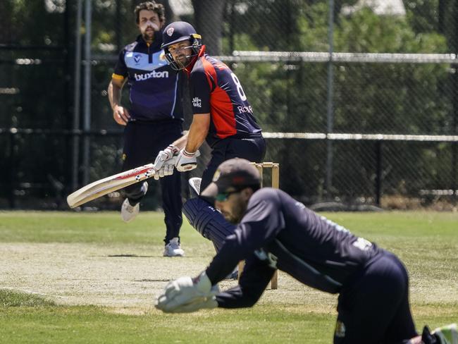 VSDCA: Tom Rickarby watches on as Rob Salerni takes the ball. Picture: Valeriu Campan