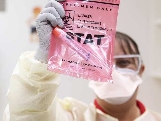 Janice Geary (clinical nurse consultant, Infection Management Service) demonstrating patient check for Covid-19 coronavirus. Fever Clinic at The Prince Charles Hospital, Rode Rd, Chermside, Brisbane, 6th of March 2020. (AAP Image/Attila Csaszar)