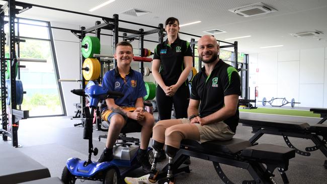 Townsville wheelchair basketball player Byron Holman, 19, with Sporting Wheelies exercise physiologist Alicia Allen and wheelchair rugby Paralympian Chris Bond. Picture: Natasha Emeck