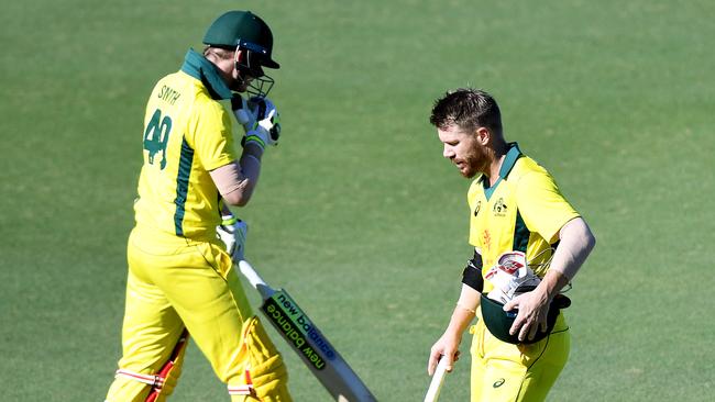 David Warner (R) and Steve Smith exchange words as the left-hander leaves the field. Picture: Getty