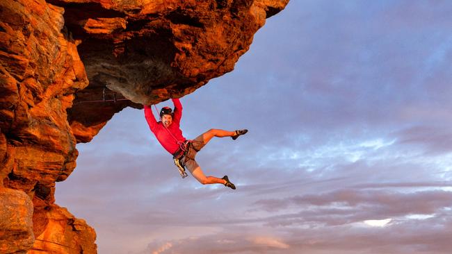 Free climber Tom Perkins swings out on Feeling the Ceiling, a grade 21 climb near the summit of Mount Arapiles in Victoria, where recent bans have infuriated the climbing community globally. Picture: Jason Edwards