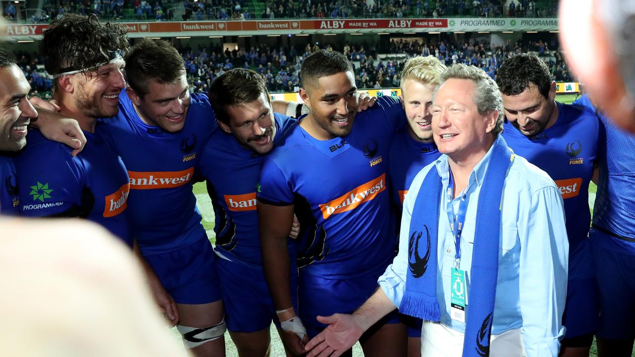 Andrew Forrest talks to Force players after a World Series Rugby match in Perth.