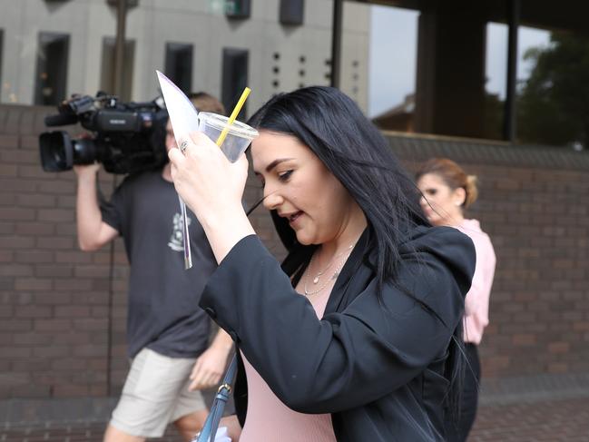 Annelise Sunderland attempted to hide her face from the camera when she appeared in court in December 2021. Pictures: John Grainger