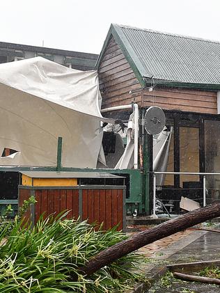 Shops have been trashed on the main street of Airlie during Cyclone Debbie. Picture: Alix Sweeney