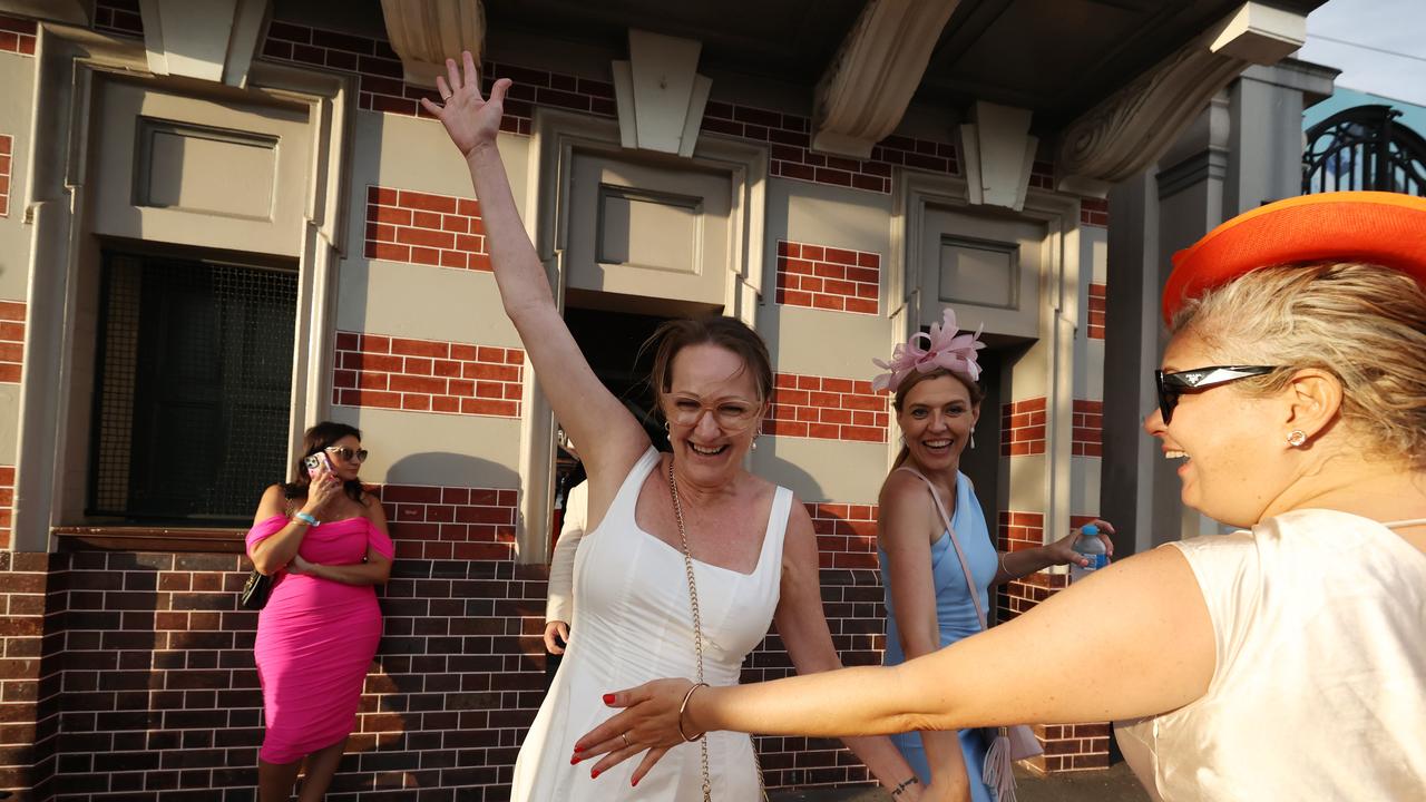 Punters leave Eagle Farm racecourse on Melbourne Cup Day.