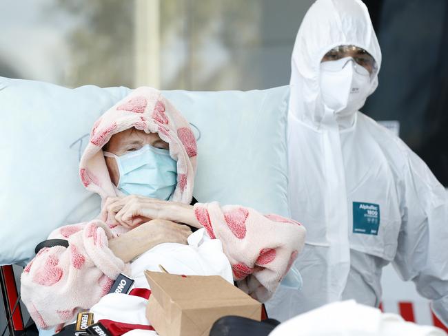 MELBOURNE, AUSTRALIA - JULY 28: A resident of Epping Gardens Aged Care Facility is taken away in a ambulance on July 28, 2020 in Melbourne, Australia. Victoria has recorded 532 new cases of coronavirus and six more deaths, yesterday making it the worst day of the pandemic. Metropolitan Melbourne and the Mitchell shire remain in lockdown due to the rise in COVID-19 cases through community transmissions, with people permitted to leave home only for exercise, work, to buy essential items, or to access childcare and healthcare and individuals are required Face coverings or be subject to a $200 fine. Lockdown measures are in place until August 19. (Photo by Darrian Traynor/Getty Images)