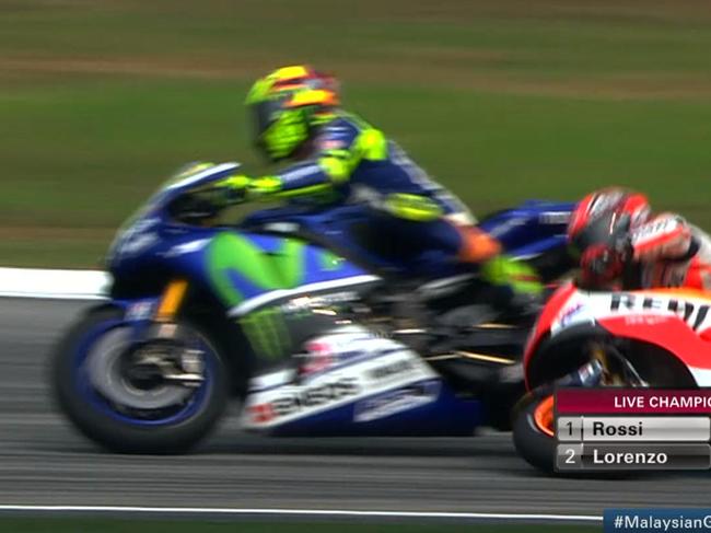 Watch: Rossi shoves Marquez off track