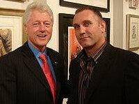 Former US president Bill Clinton with Adrian Gard.