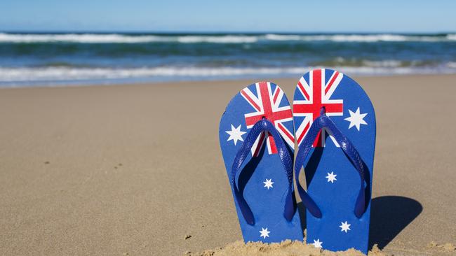 Australian flag flip flop thongs on a beach