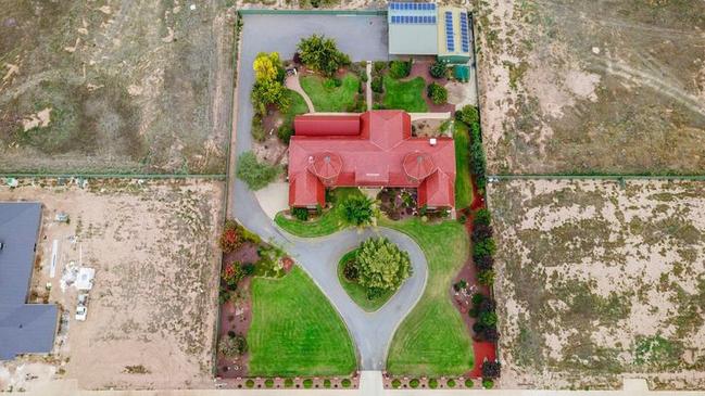 An aerial view of the castle-like home.