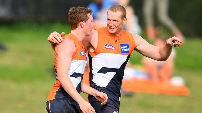 Tom Green of the Giants (left) celebrates with Sam Jacobs after kicking a goal against Sydney last month. Picture: AAP Image/Dan Himbrechts