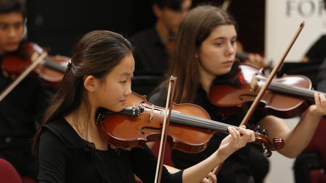 Members of the Western Sydney Youth Orchestra prepare for Sunday’s concert.