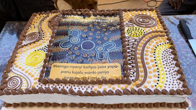 The Yuendumu community celebrated Yuendumu School's 50th anniversary bilingual of education with a large cake. Picture: Supplied