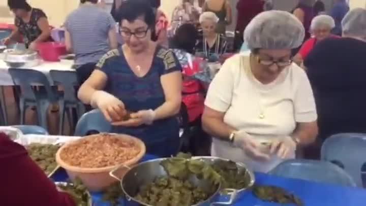 Thousands of dolmades being made for Darwin's Glenti Greek festival.