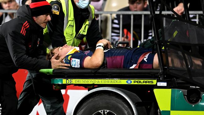 CHRISTCHURCH, NEW ZEALAND - JUNE 03: Tate McDermott of the Reds is assisted from the field of play by medics during the Super Rugby Pacific Quarter Final match between the Crusaders and the Queensland Reds at Orangetheory Stadium on June 03, 2022 in Christchurch, New Zealand. (Photo by Joe Allison/Getty Images)